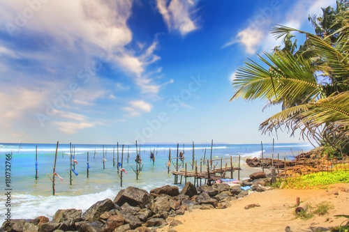 SRI LANKA - MARCH 24: Traditional fishing - Fishermen on a stick in Sri Lanka on march 24 2017 on Sri Lanka