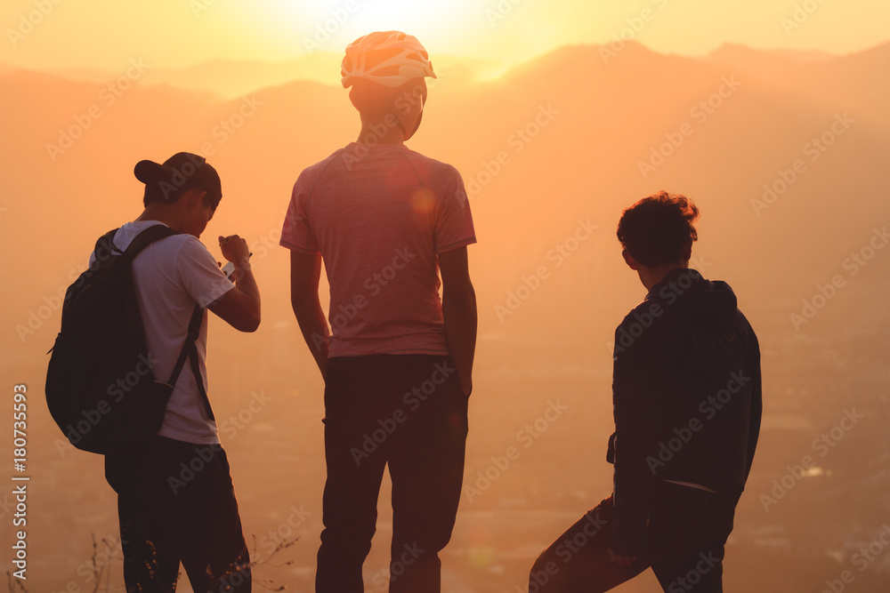 Group of young men watching beautiful sunset