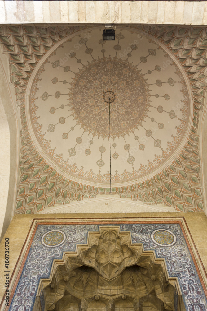 Architectural view of the upper part and decorated ceiling of the entrance of Gazi Husrev beg Mosque in Sarajevo