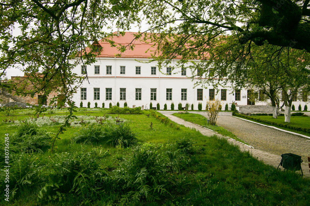Well-preserved old building with garden and green alley at the Dubno Castle in Ukraine