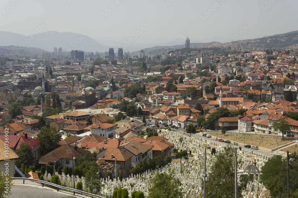 View from the top of Yellow Fortess of the city of Sarajevo, with a huje war cemetery in the foreground