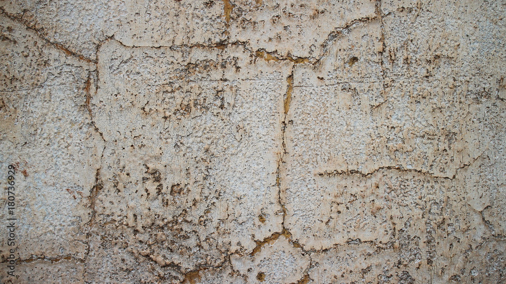 Naklejka premium Muro com buraco e rachaduras multicor