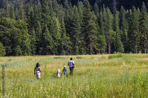 A family walks through the grass in Yosemite Valley, California © J. Ossorio Castillo