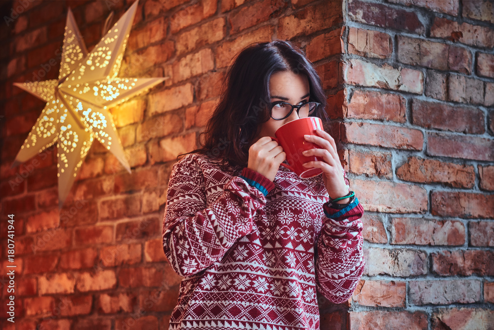 A woman drinks coffee.