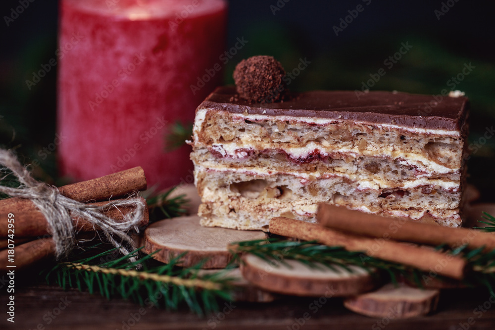 Christmas tasty cake on dark wooden background with spruce decoration. Christmas tasty cake on dark wooden background with spruce decoration.