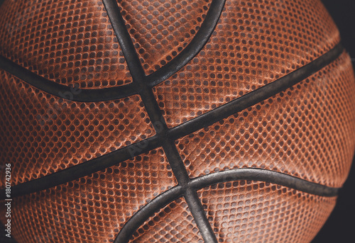 Old basketball ball on black background closeup © Prostock-studio