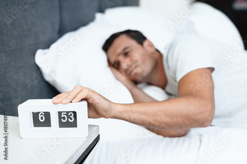 Фотография The disabled person sleeps in his white bed