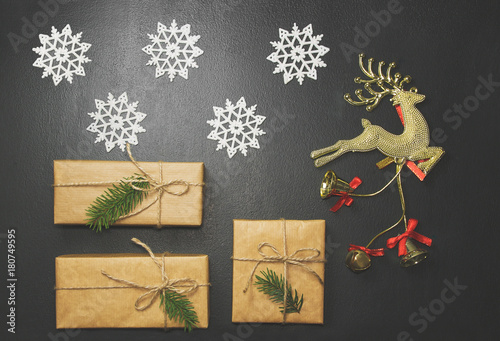 Christmas, New Year black stylish background and frame with gifts and a golden deer
