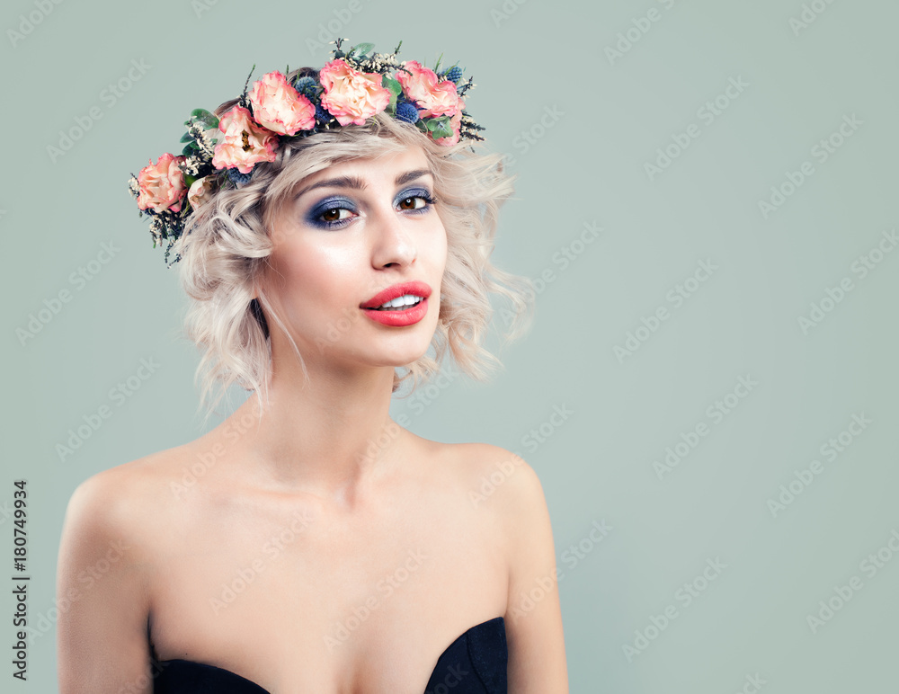 Spring Woman Fashion Model with Rose Flowers on her Head. Cute Girl with Blonde Bob Hairstyle and Makeup