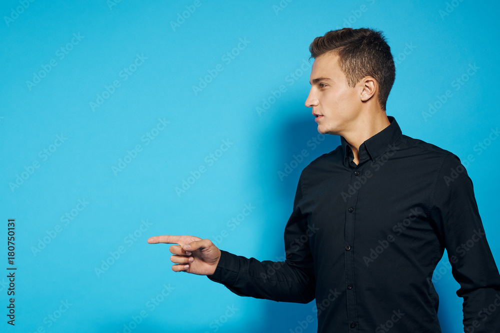 man in black shirt points finger direction man in black shirt points finger direction