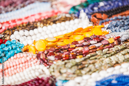 Many decorative necklaces made of colorful stones
