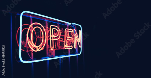 "OPEN" restaurant sign in night time with blank copy space, black background