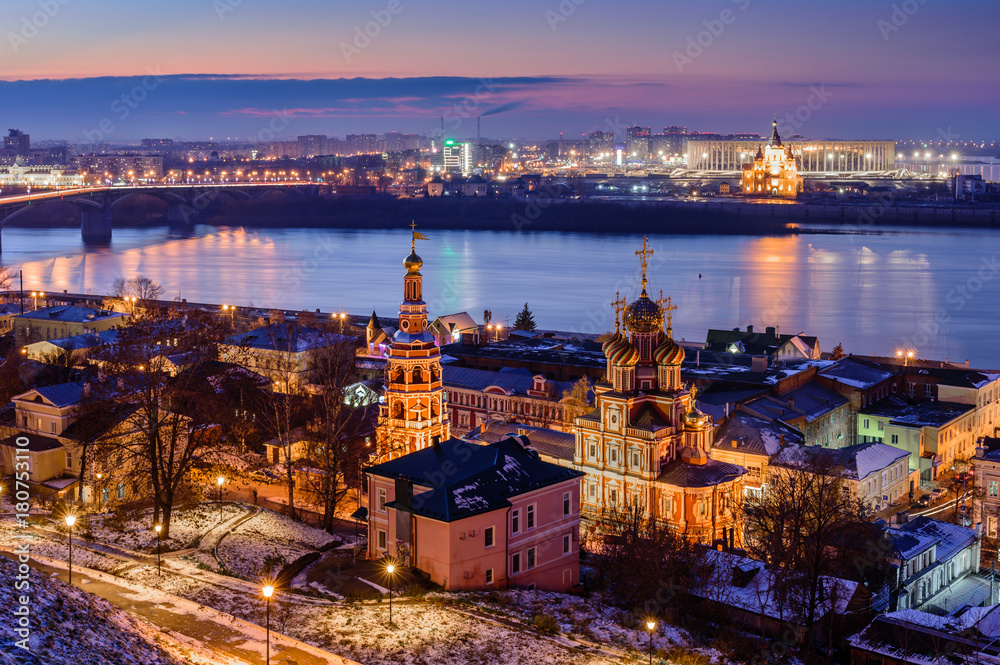 Beautiful panoramic view of the evening city near Kremlin with the Stroganov Church and Oka river. Nizhny Novgorod city, Russia.