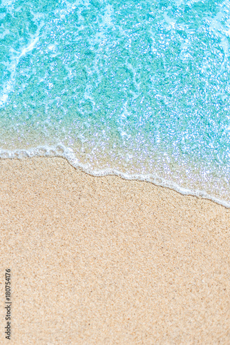 Fototapeta Naklejka Na Ścianę i Meble -  Sea Beach and Soft wave of blue ocean.  Summer vacation and travel concept. Copy space