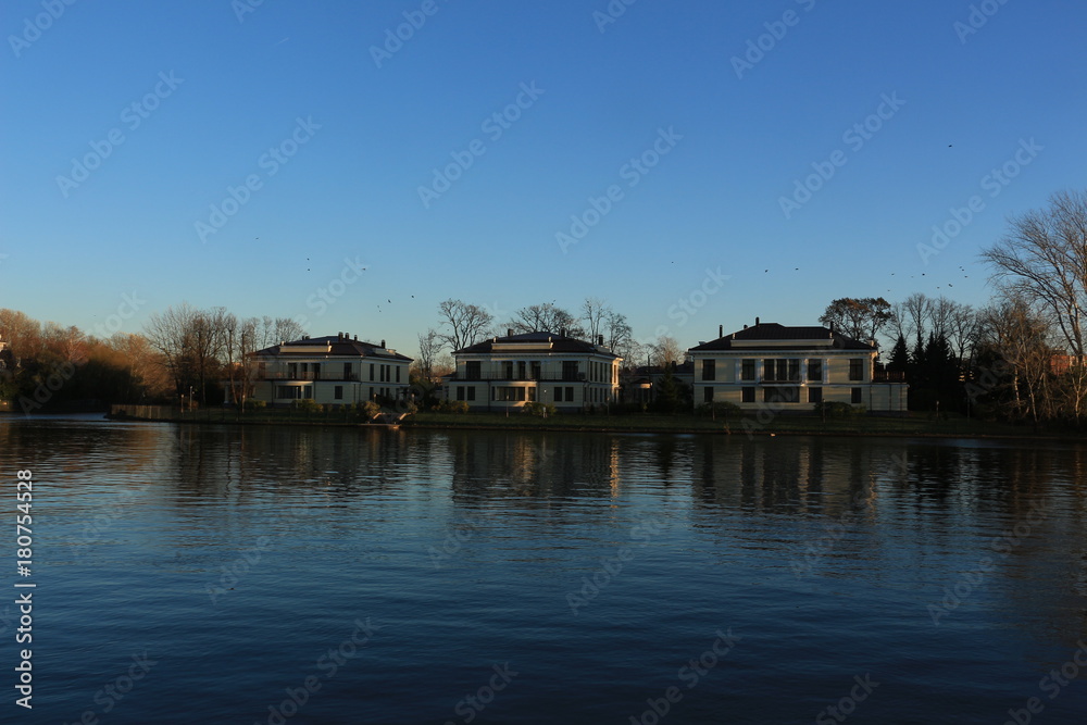 cottages on the river bank with reflection