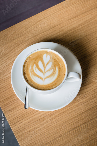 Closeup coffee in cup on the table,warm tone