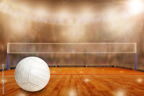 Fictitious volleyball arena with ball on court and copy Space. Focus on foreground with special lighting and lens flare effect on background.
