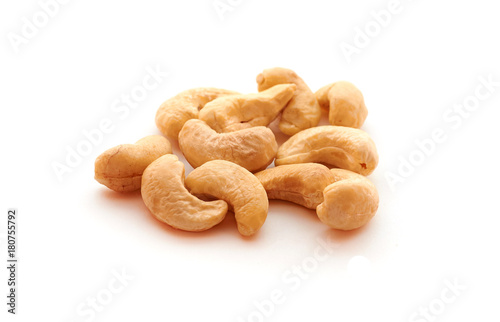 Cashew nuts heap on white background