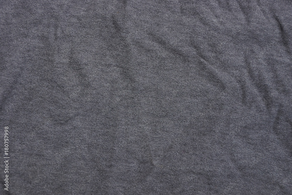 серая текстура ткани из мятой тёмной материи одежды