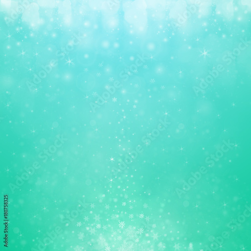 Christmas winter abstract background with snowflakes, bokeh lights and place for text. Christmas New Year's wallpaper