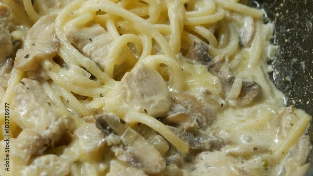 white sauce in mushrooms and chicken white meat. Close-up white sauce in mushrooms and chicken white meat. Close-up