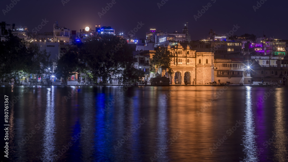 Full moon over the Gangaur Ghat from Lake Pichola, Udaipur, Rajasthan, India