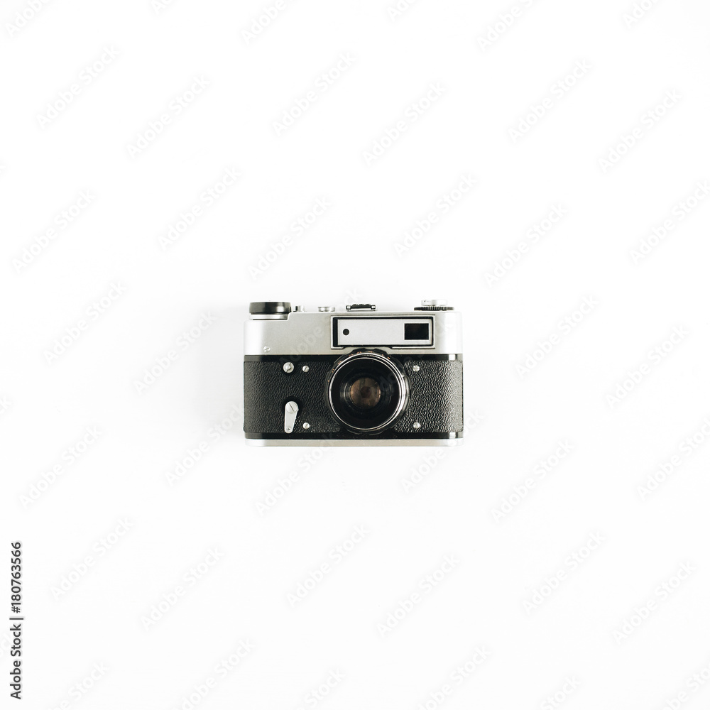 Retro photo camera. Minimalistic hipster flat lay concept.