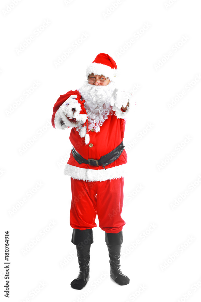 Real Santa Claus carrying big bag full of gifts, isolated on white background Real Santa Claus carrying big bag full of gifts, isolated on white background