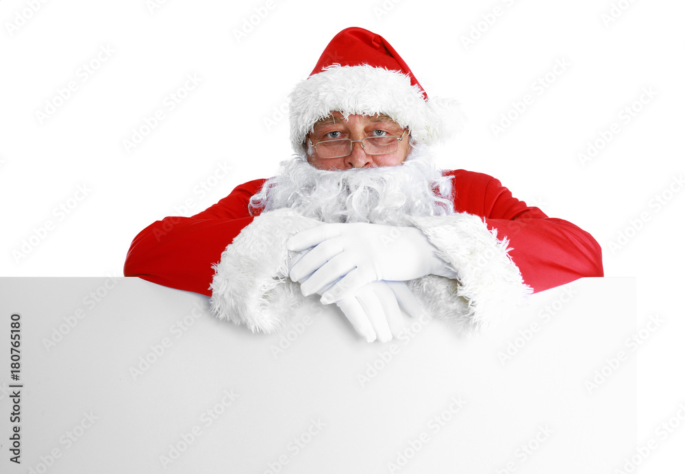 Happy Santa Claus looking out from behind the blank sign isolated on white background Happy Santa Claus looking out from behind the blank sign isolated on white background