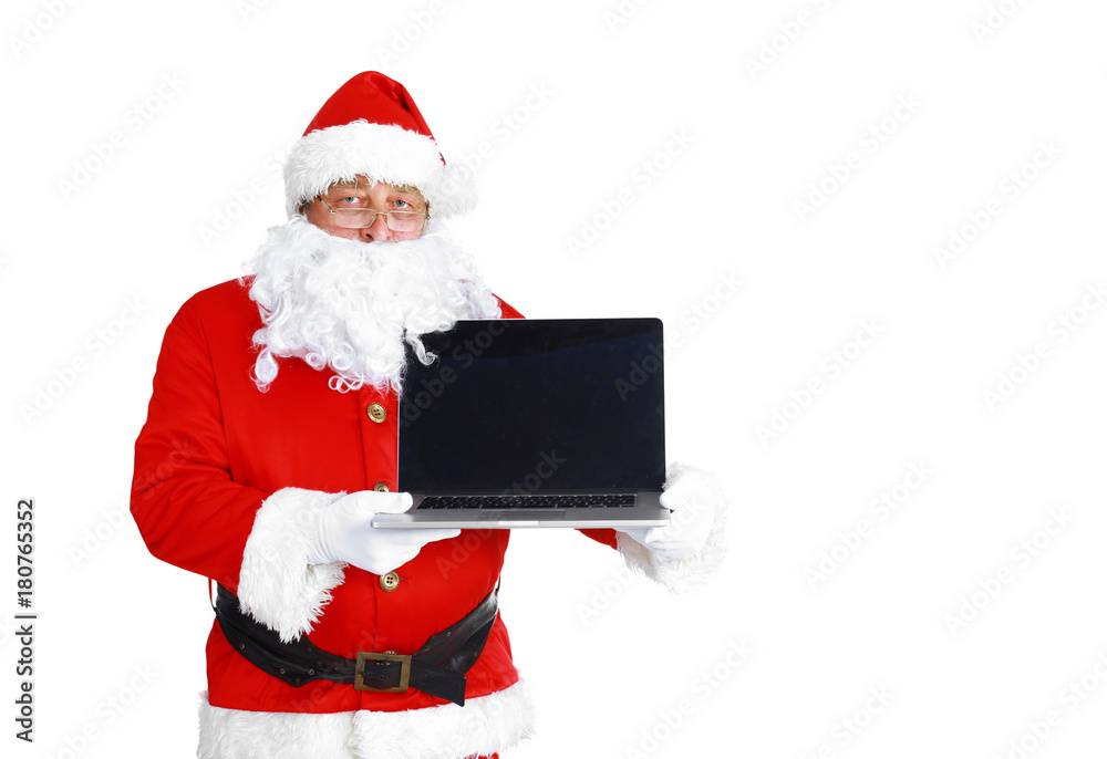 Santa Claus presents a laptop on white background Santa Claus presents a laptop on white background
