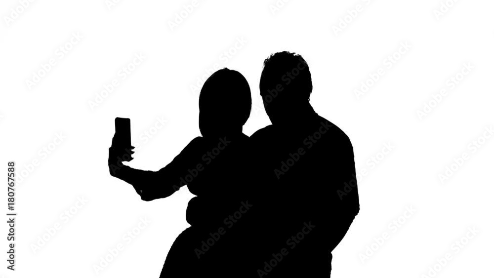 Guy and the girl are making selfies. Silhouette. White background Guy and the girl are making selfies. Silhouette. White background