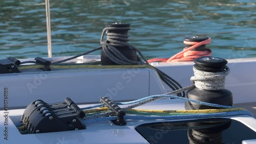 Winches and ropes in the maneuvering area on a sailing boat.