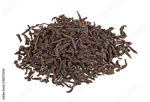Dry black tea leaves isolated on a white background