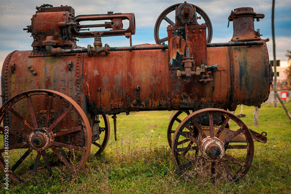 Old rusty train locomotive. Old abandoned track, siding with dirty old trains. Old railway tracks