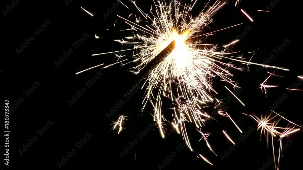 Sparklers close and beautifully lit. Lights sparked and burned in his hands. Festive Sparkler close - an attribute of good mood. Sparklers close and beautifully lit. Lights sparked and burned in his hands. Festive Sparkler close - an attribute of good mood.