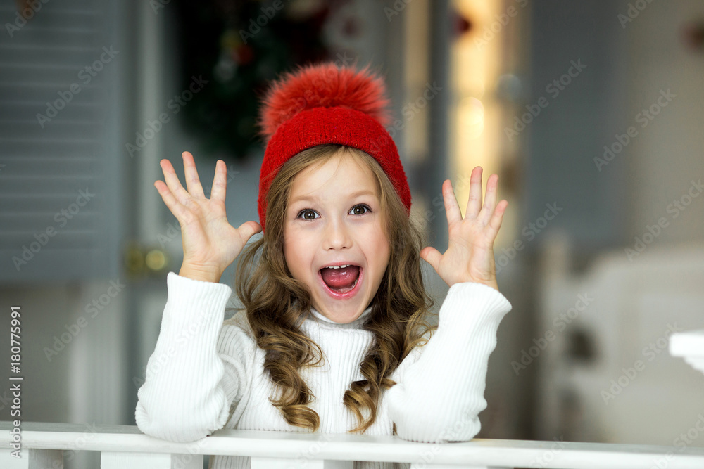 Smiling funny girl in red hat. Christmas concept. Smiling funny girl in red hat. Christmas concept.