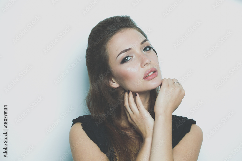 Beautiful young woman standing, isolated on white background. Sexy woman