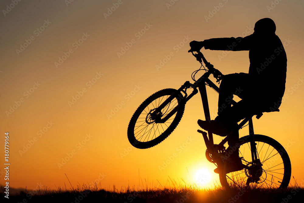 silhouette of biker silhouette of biker
