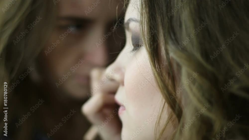 Artist applying eye shadow on beautiful woman eyes Artist applying eye shadow on beautiful woman eyes