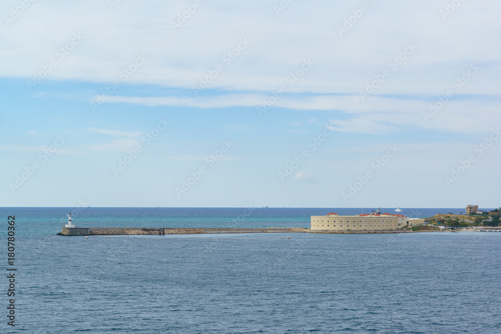 Konstantinovskaya battery, and a pier with a lighthouse at the exit from Sevastopol Bay