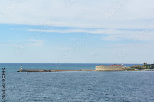 Konstantinovskaya battery, and a pier with a lighthouse at the exit from Sevastopol Bay