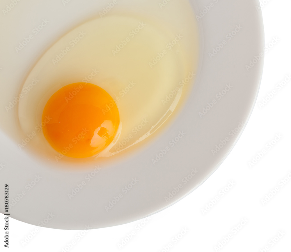 A fresh chicken egg, on the plate, isolated on a white background A fresh chicken egg, on the plate, isolated on a white background
