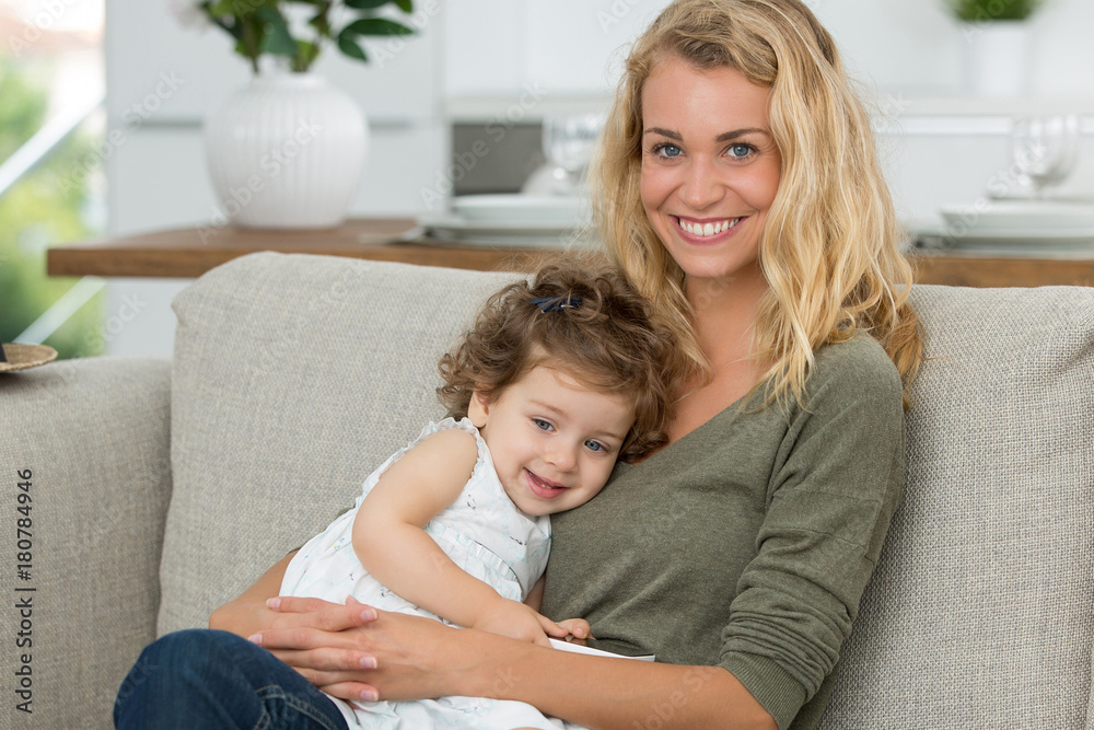 happy little girl doing big hug to mother happy little girl doing big hug to mother