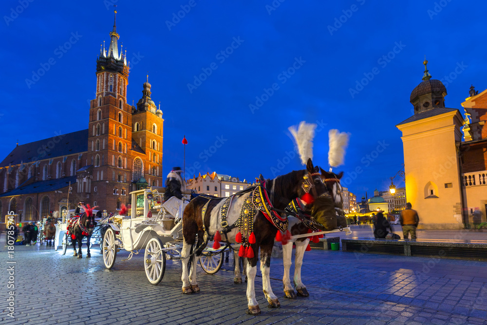 Fototapeta Horse carriages at the Main Square in Krakow, Poland