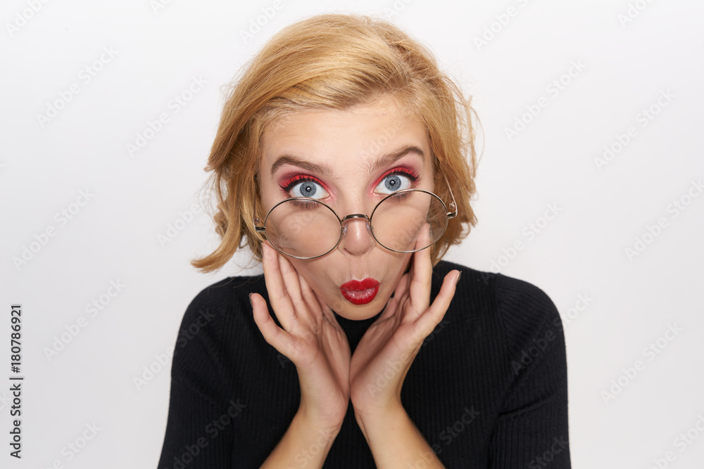 blonde in glasses fools around, close-up