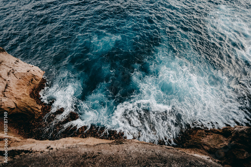 Aerial view to ocean waves and rock coast © Ivan Kurmyshov