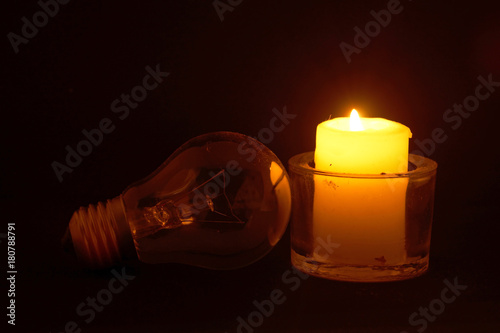 Obraz na płótnie Burning candle and lamp. Power outage. w salonie