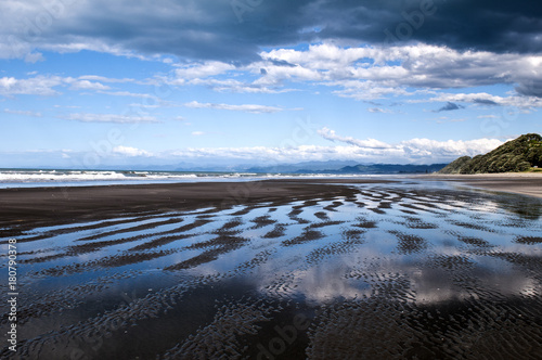Beautiful reflections on Waiotahe Beach in Opotiki, New Zealand 