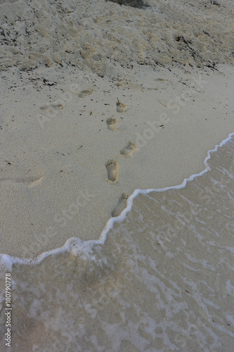 Footprints on a sandy beach