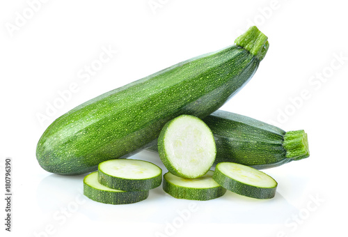 fresh green zucchini with slice isolated on white background